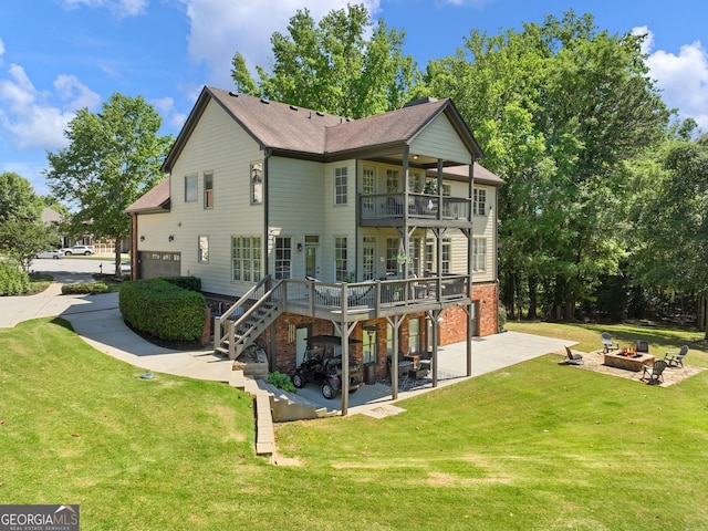 70 Baker Pond Ct, Jefferson, GA 30549 - back of property featuring a fire pit, a balcony, a patio area, a garage, and a lawn