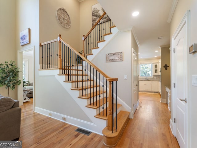 70 Baker Pond Ct, Jefferson, GA 30549 - stairs with hardwood / wood-style floors, crown molding, recessed lighting, and baseboards
