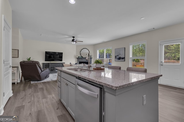 206 Roundwood Way, Peachtree City, GA 30269 - kitchen featuring stainless steel dishwasher, a ceiling fan, light wood finished floors, light stone countertops, and recessed lighting