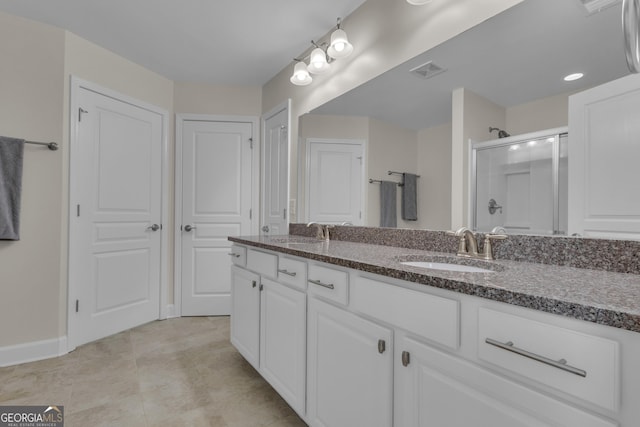 206 Roundwood Way, Peachtree City, GA 30269 - bathroom featuring double vanity, a stall shower, and tile patterned flooring