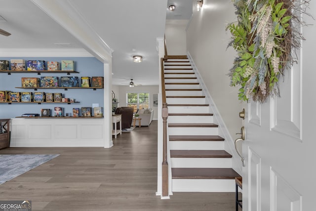 206 Roundwood Way, Peachtree City, GA 30269 - stairs with wood finished floors, crown molding, and ceiling fan