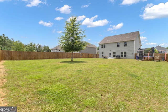 206 Roundwood Way, Peachtree City, GA 30269 - fenced backyard featuring a trampoline