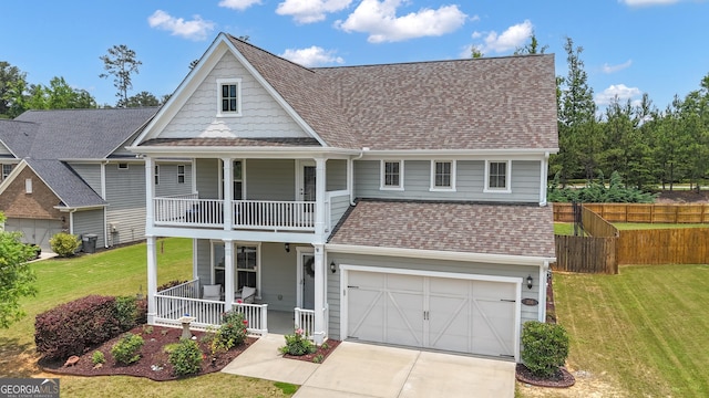 206 Roundwood Way, Peachtree City, GA 30269 - view of front of home with a porch, a balcony, an attached garage, concrete driveway, and roof with shingles