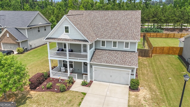 206 Roundwood Way, Peachtree City, GA 30269 - view of front of home featuring a porch, a balcony, driveway, roof with shingles, and an attached garage