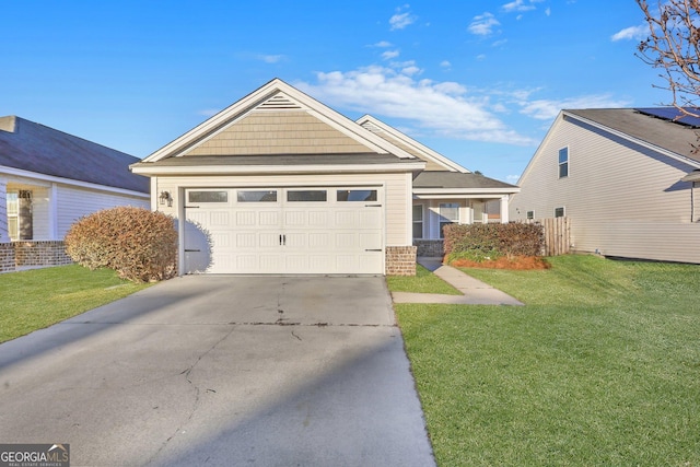 17 Sandy Point Way, Port Wentworth, GA 31407 - view of front of house with driveway, a front yard, a garage, and brick siding