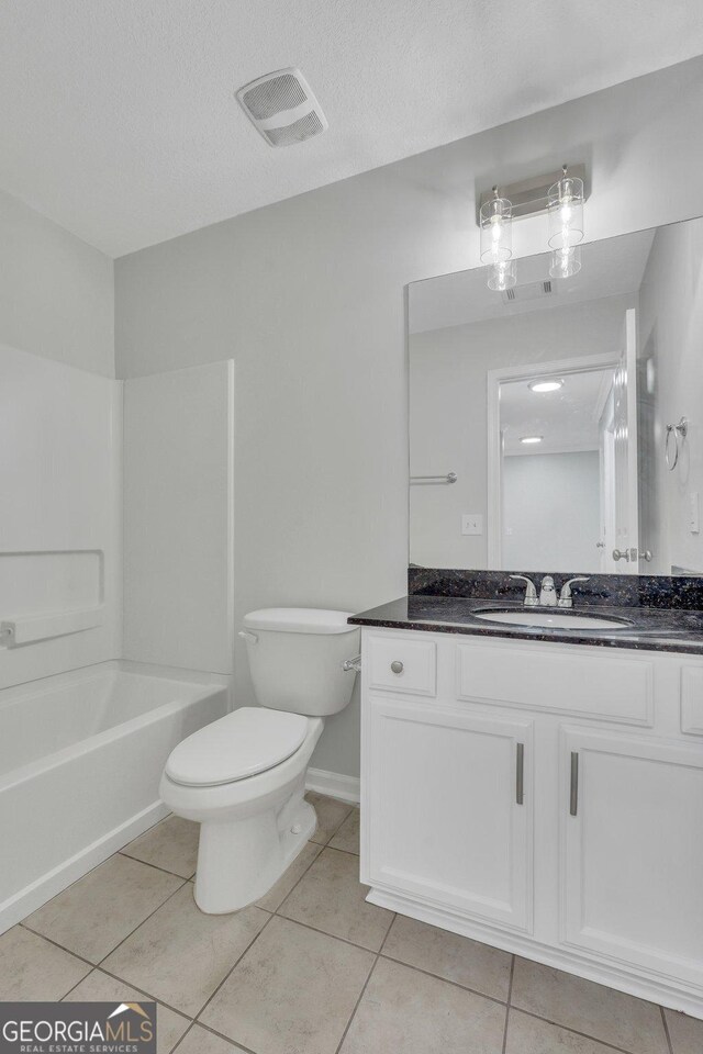 17 Sandy Point Way, Port Wentworth, GA 31407 - bathroom featuring toilet, vanity, tile patterned flooring, bathing tub / shower combination, and baseboards