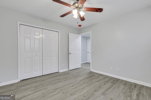 17 Sandy Point Way, Port Wentworth, GA 31407 - unfurnished bedroom featuring wood finished floors, baseboards, a closet, and ceiling fan