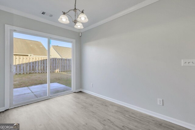 17 Sandy Point Way, Port Wentworth, GA 31407 - empty room with ornamental molding, a chandelier, baseboards, and wood finished floors