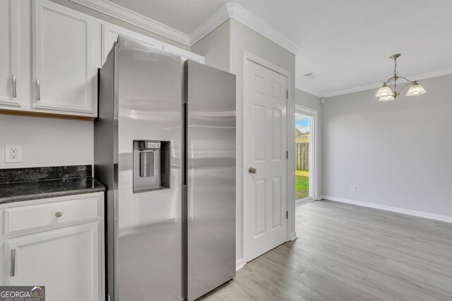 17 Sandy Point Way, Port Wentworth, GA 31407 - kitchen featuring stainless steel fridge, ornamental molding, a chandelier, white cabinets, and light wood-type flooring