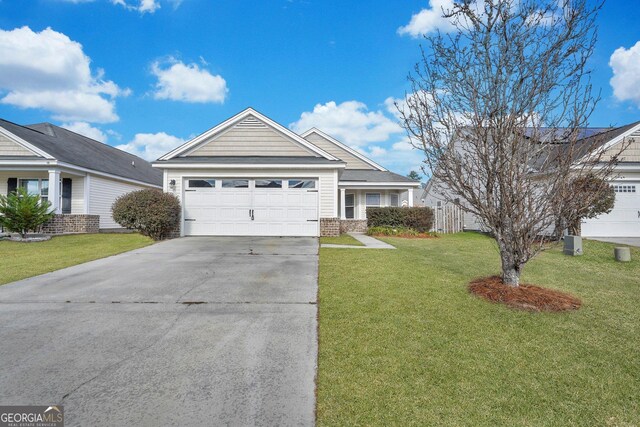 17 Sandy Point Way, Port Wentworth, GA 31407 - ranch-style house with a front lawn, concrete driveway, a garage, and brick siding