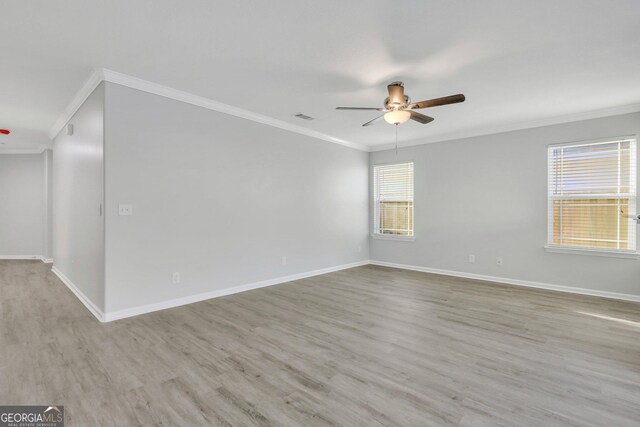 17 Sandy Point Way, Port Wentworth, GA 31407 - unfurnished room with crown molding, a ceiling fan, wood finished floors, and baseboards