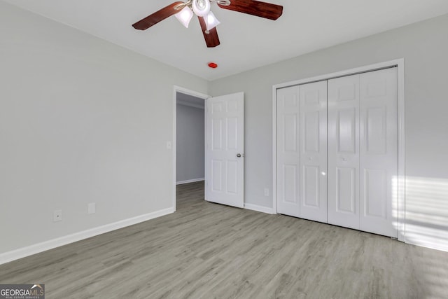 17 Sandy Point Way, Port Wentworth, GA 31407 - unfurnished bedroom featuring wood finished floors, a closet, baseboards, and a ceiling fan