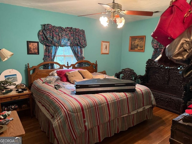 1268 Woodland Rd NE, Conyers, GA 30012 - bedroom with wood finished floors and ceiling fan