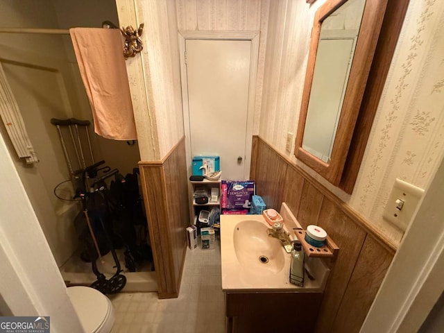 1268 Woodland Rd NE, Conyers, GA 30012 - bathroom featuring vanity, wainscoting, and tile patterned floors