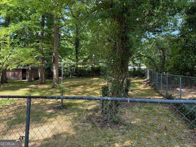 1268 Woodland Rd NE, Conyers, GA 30012 - view of yard featuring an outbuilding