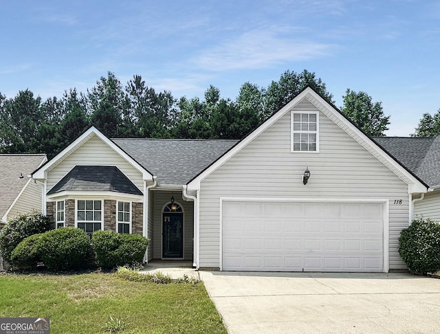 118 Hunterian Pl, Newnan, GA 30265 - view of front of house featuring driveway, an attached garage, a shingled roof, and a front yard