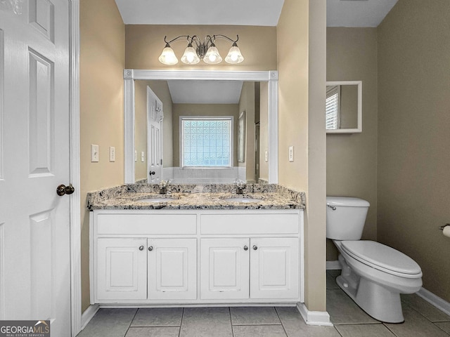 118 Hunterian Pl, Newnan, GA 30265 - bathroom featuring double vanity, baseboards, toilet, and tile patterned flooring
