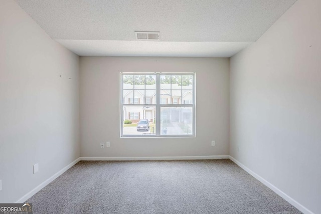 2255 Bigwood Trl, Atlanta, GA 30349 - unfurnished room with carpet, a textured ceiling, and baseboards