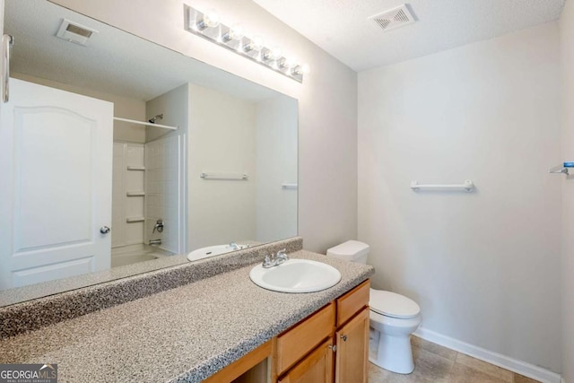 2255 Bigwood Trl, Atlanta, GA 30349 - bathroom with toilet, vanity, bathtub / shower combination, baseboards, and tile patterned flooring