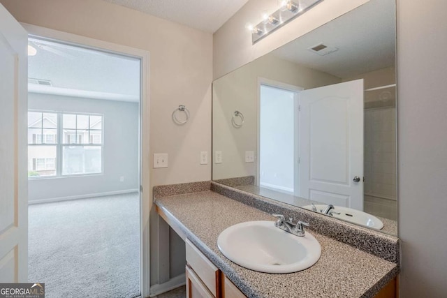 2255 Bigwood Trl, Atlanta, GA 30349 - bathroom with vanity and baseboards