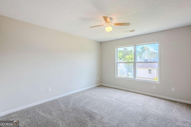 2255 Bigwood Trl, Atlanta, GA 30349 - carpeted empty room with a ceiling fan, baseboards, and a textured ceiling