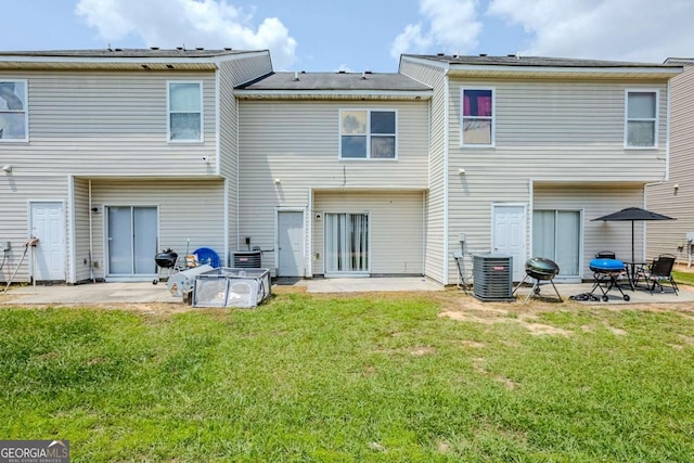 2255 Bigwood Trl, Atlanta, GA 30349 - back of house with a patio area, central AC, and a yard