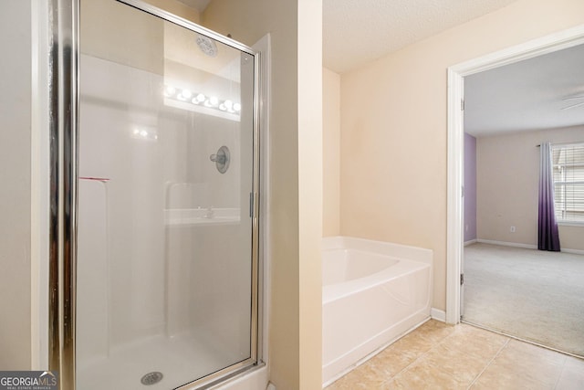 3262 Cascade Parc Blvd SW, Atlanta, GA 30311 - bathroom featuring a shower stall, a garden tub, and tile patterned flooring