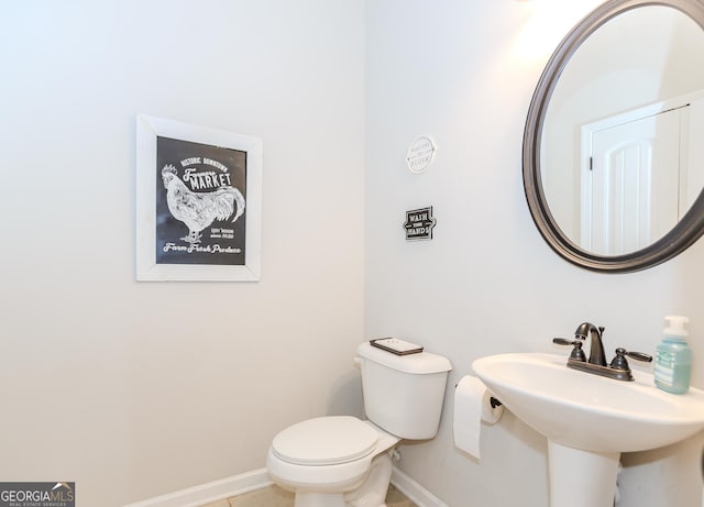 1243 Glenville Ct, Hoschton, GA 30548 - bathroom with baseboards, toilet, tile patterned floors, and a sink