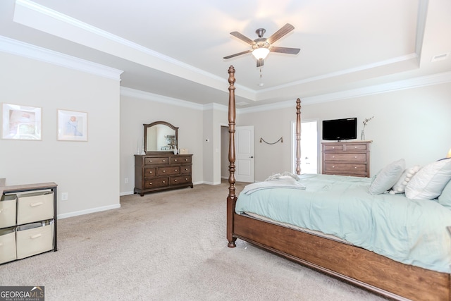 1243 Glenville Ct, Hoschton, GA 30548 - carpeted bedroom with a tray ceiling, ornamental molding, baseboards, and a ceiling fan