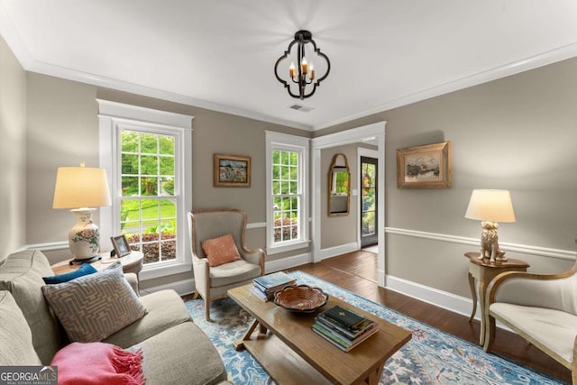 1540 Kinglet Ln, Marietta, GA 30062 - living area with a chandelier, baseboards, crown molding, and wood finished floors