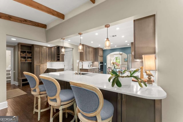 1540 Kinglet Ln, Marietta, GA 30062 - kitchen with a sink, recessed lighting, a peninsula, open shelves, and crown molding