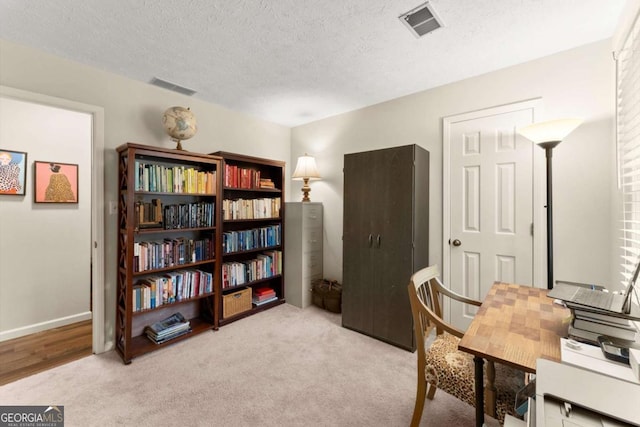 1540 Kinglet Ln, Marietta, GA 30062 - home office featuring a textured ceiling, carpet flooring, and baseboards
