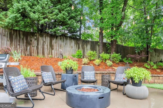 1540 Kinglet Ln, Marietta, GA 30062 - fenced backyard with a fire pit and a patio area