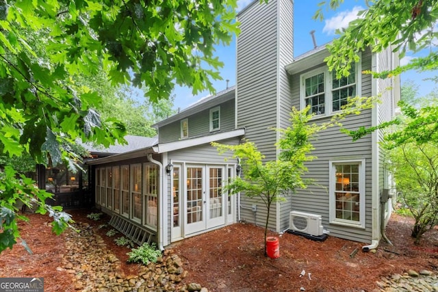 1540 Kinglet Ln, Marietta, GA 30062 - rear view of property with a chimney, a sunroom, a cooling unit, and french doors
