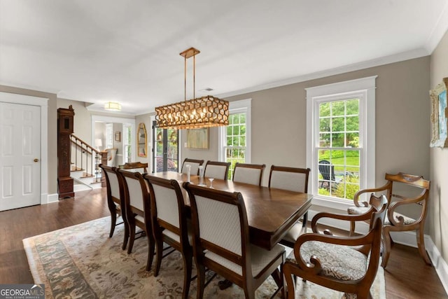1540 Kinglet Ln, Marietta, GA 30062 - dining room with stairway, dark wood-type flooring, ornamental molding, and baseboards