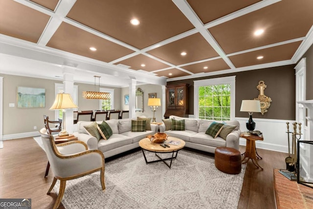 1540 Kinglet Ln, Marietta, GA 30062 - living room featuring coffered ceiling, ornate columns, wood finished floors, recessed lighting, and wainscoting