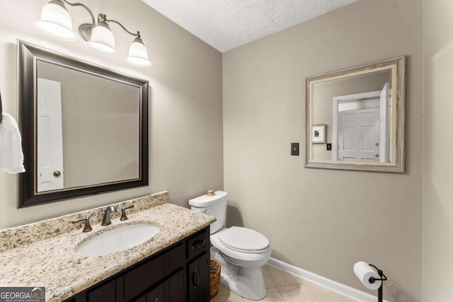 1540 Kinglet Ln, Marietta, GA 30062 - half bathroom featuring toilet, tile patterned flooring, vanity, a textured ceiling, and baseboards