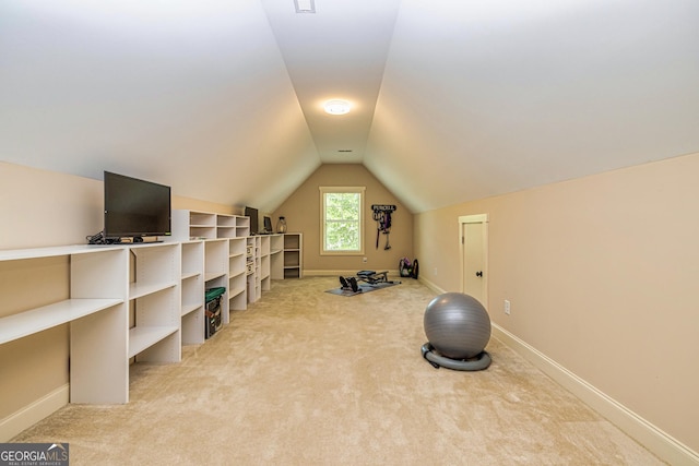 172 Walden Pond Trl, Senoia, GA 30276 - workout area with light colored carpet, lofted ceiling, and baseboards