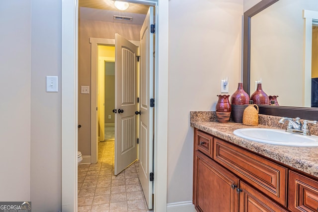 172 Walden Pond Trl, Senoia, GA 30276 - bathroom with vanity, toilet, and baseboards