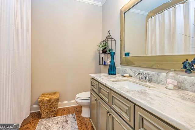 172 Walden Pond Trl, Senoia, GA 30276 - bathroom featuring crown molding, toilet, vanity, wood finished floors, and baseboards