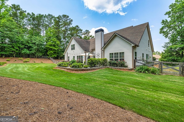 172 Walden Pond Trl, Senoia, GA 30276 - back of property with a chimney and a shingled roof