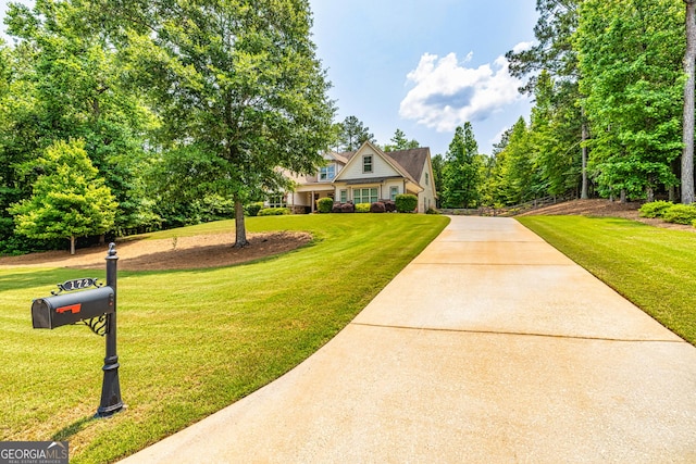 172 Walden Pond Trl, Senoia, GA 30276 - view of front of house with concrete driveway and a front yard