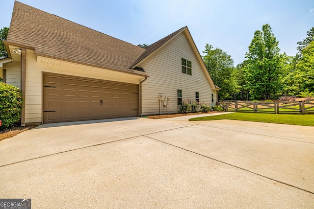 172 Walden Pond Trl, Senoia, GA 30276 - view of home's exterior featuring concrete driveway, a shingled roof, and a garage
