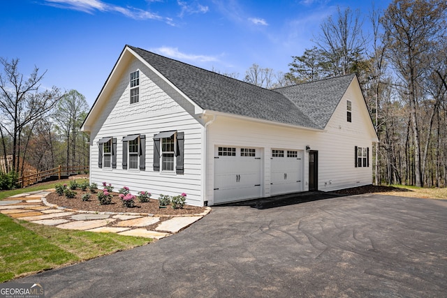 219 Fairview Dr, Morganton, GA 30560 - view of side of property featuring a shingled roof, a garage, and driveway