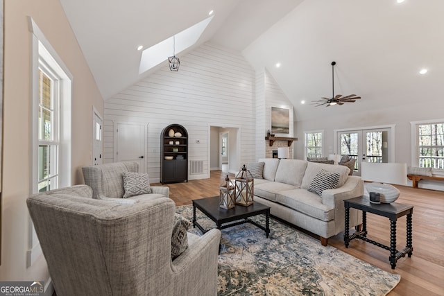 219 Fairview Dr, Morganton, GA 30560 - living room with high vaulted ceiling, a skylight, light wood-type flooring, a ceiling fan, and recessed lighting