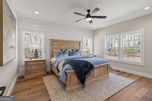 219 Fairview Dr, Morganton, GA 30560 - bedroom featuring hardwood / wood-style flooring, recessed lighting, ceiling fan, and wood walls