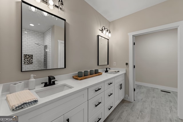 219 Fairview Dr, Morganton, GA 30560 - full bathroom with double vanity, a shower stall, and wood finished floors