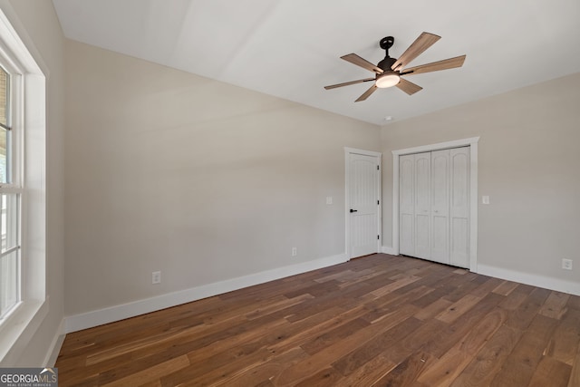 219 Fairview Dr, Morganton, GA 30560 - unfurnished bedroom featuring dark wood-type flooring, a ceiling fan, and a closet