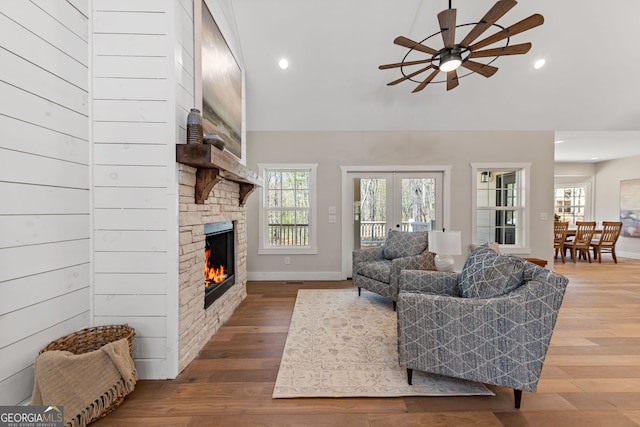 219 Fairview Dr, Morganton, GA 30560 - living room with a ceiling fan, a stone fireplace, wood finished floors, recessed lighting, and high vaulted ceiling