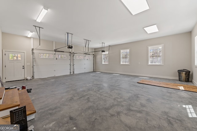 219 Fairview Dr, Morganton, GA 30560 - garage featuring a garage door opener and baseboards
